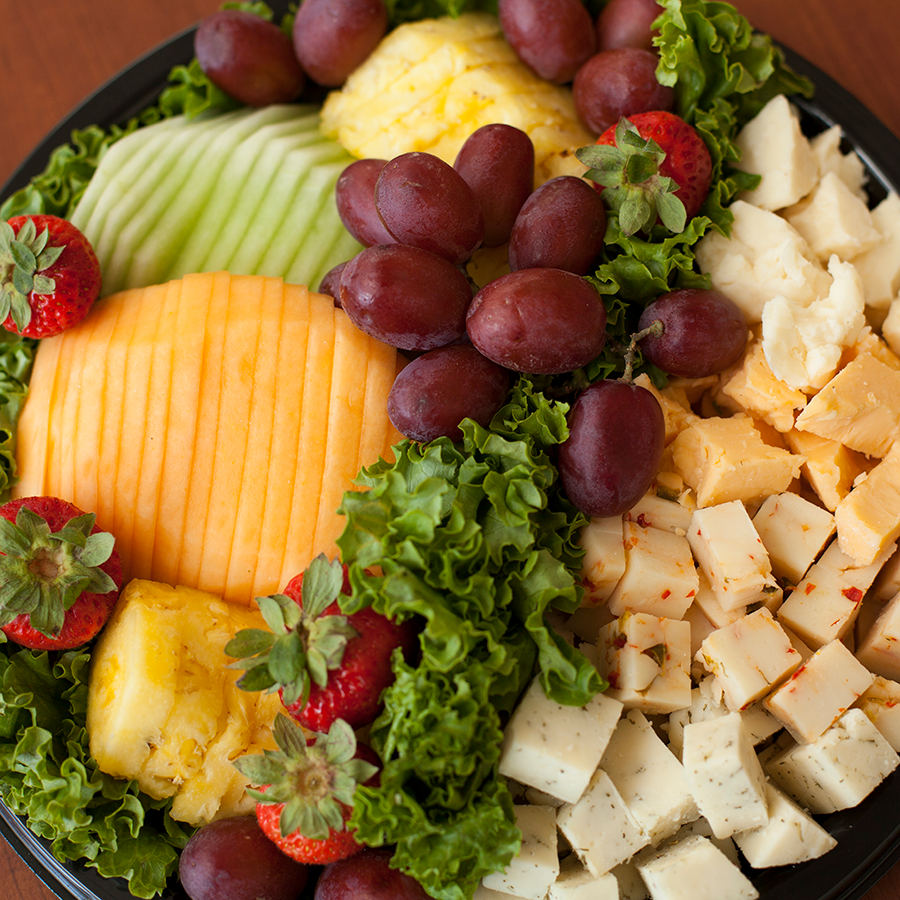 A cheese and fruit platter.