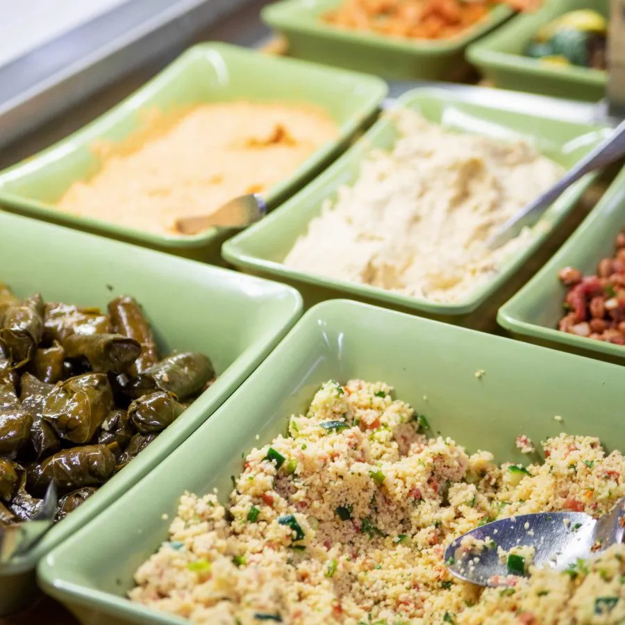 Small bowls filled with Mediterranean-style food.