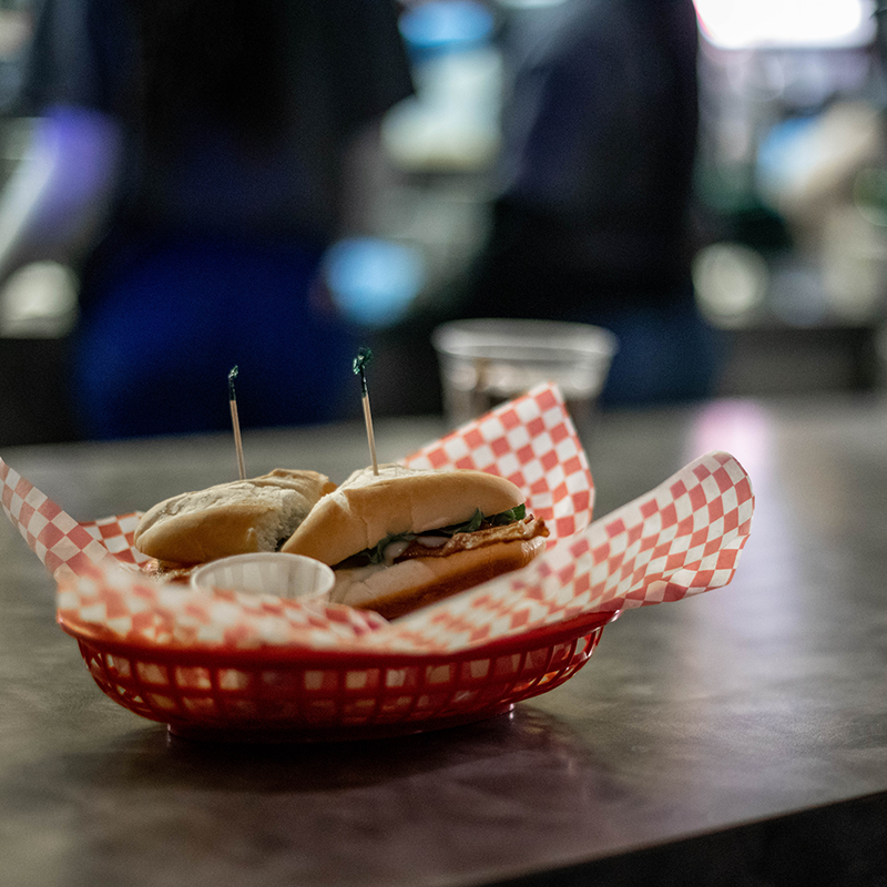 A sandwich in a plastic serving tray.