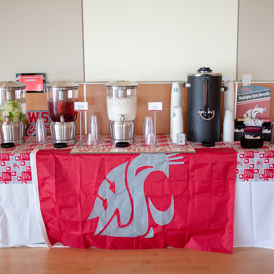 Several types of beverages on a table with the WSU logo.