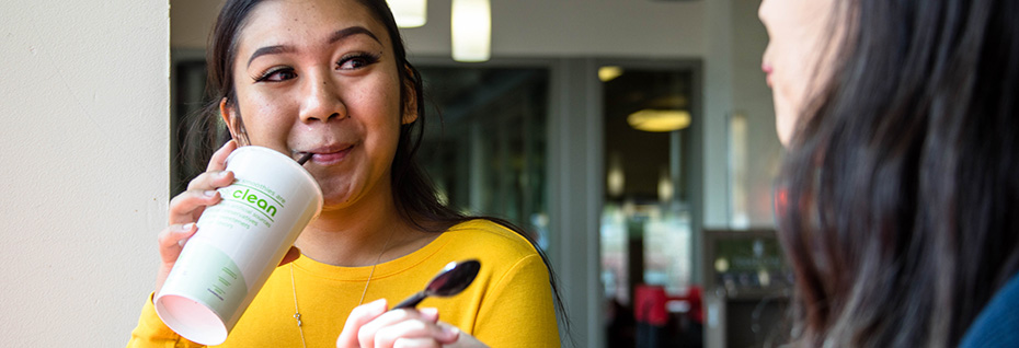 student drinks smoothie